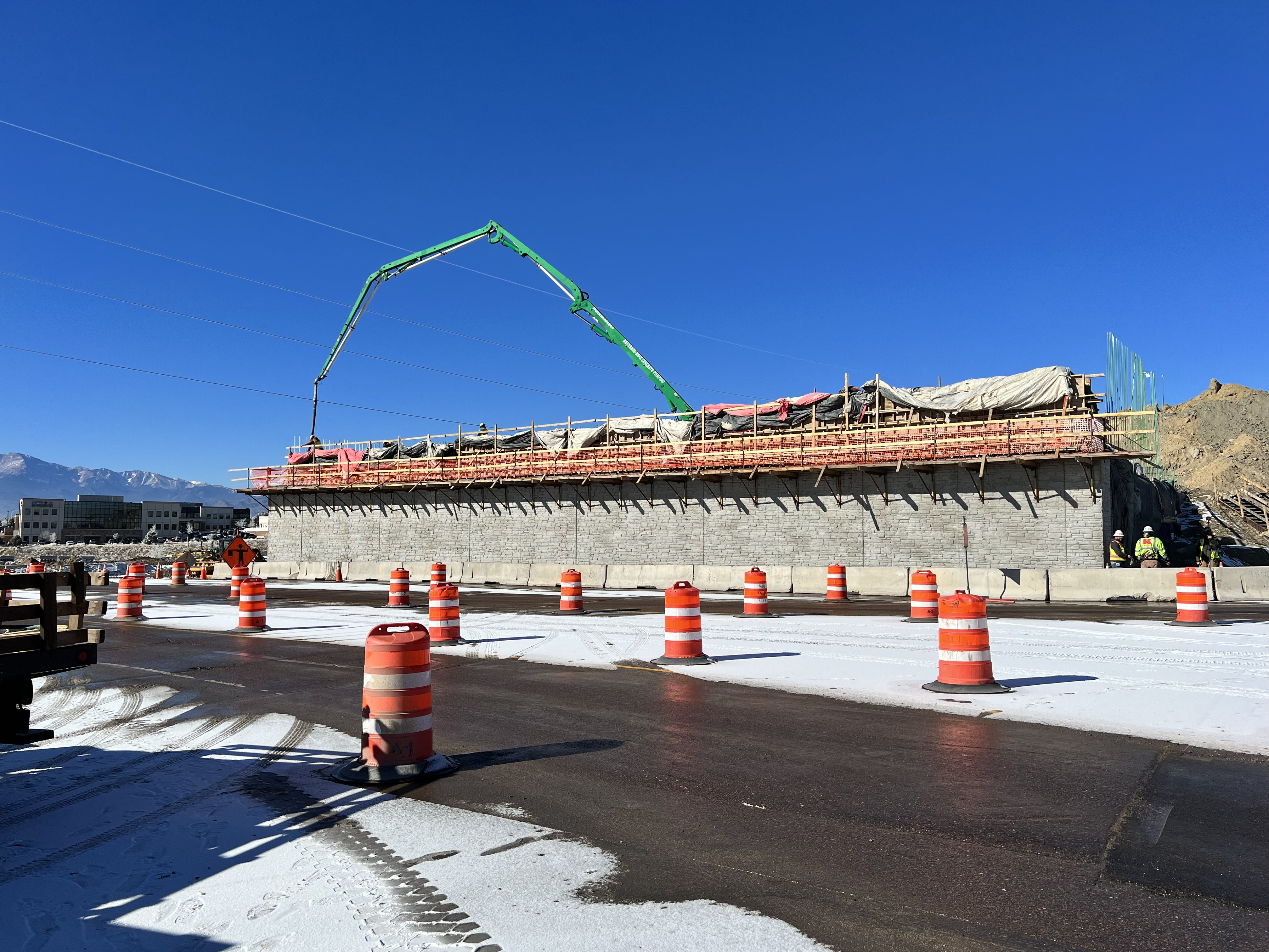 Crews pouring the north abutment of new Powers Blvd bridge.jpg detail image