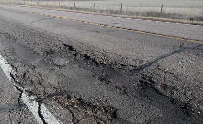 Close up of damaged asphalt.