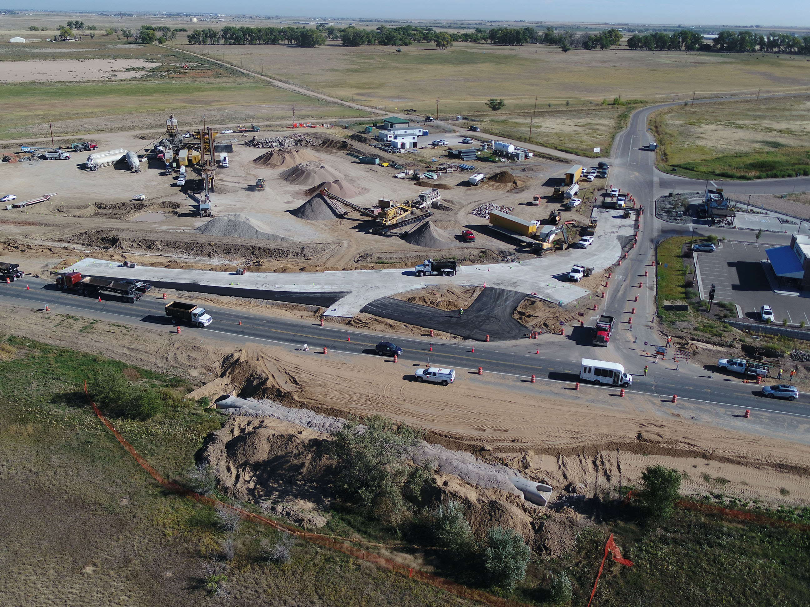 Construction progress photos for CO 52 includes widening the bridge and an oversized new roundabout. Drone photos provided by CDOT. detail image