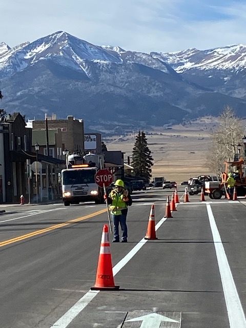 crews finishing up striping at intersection of Main and CO 69.jpg detail image