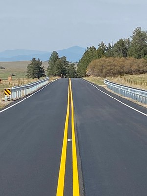 Newly paved top mat CO 69 and new guardrails.