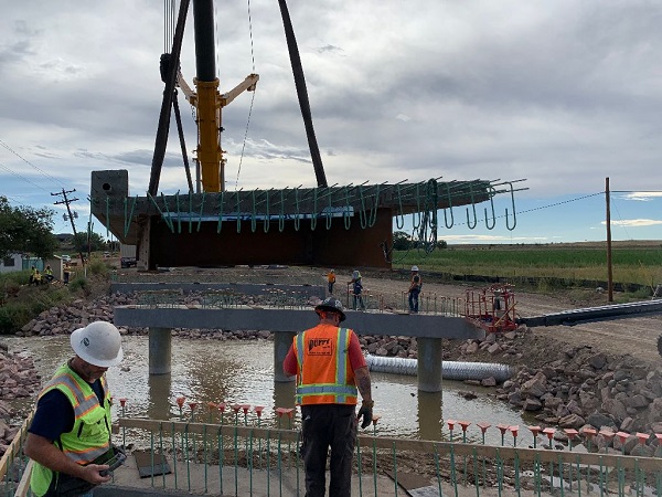 Crews preparing to lower deck onto bridge superstructure