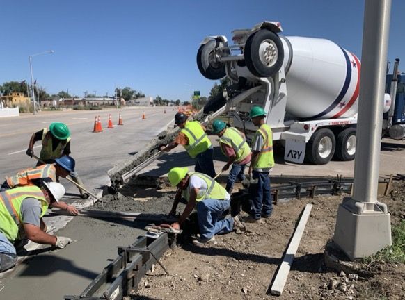Crews laying new concrete and upgrading curb ramp at US 40 and Welton in Kit Carson.jpg detail image