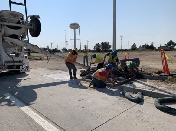 Crews replacing curb ramp on US 40 at Grand Street in Kit Carson.jpg detail image
