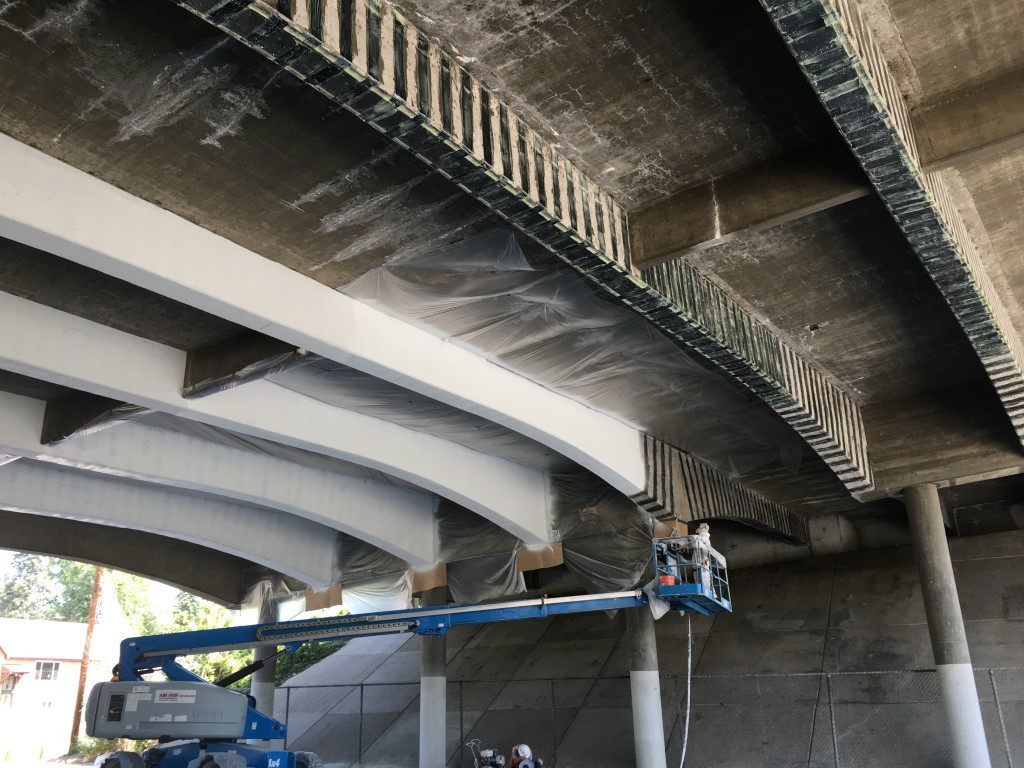 Crews work on painting the Tennyson Street Bridge.jpg detail image