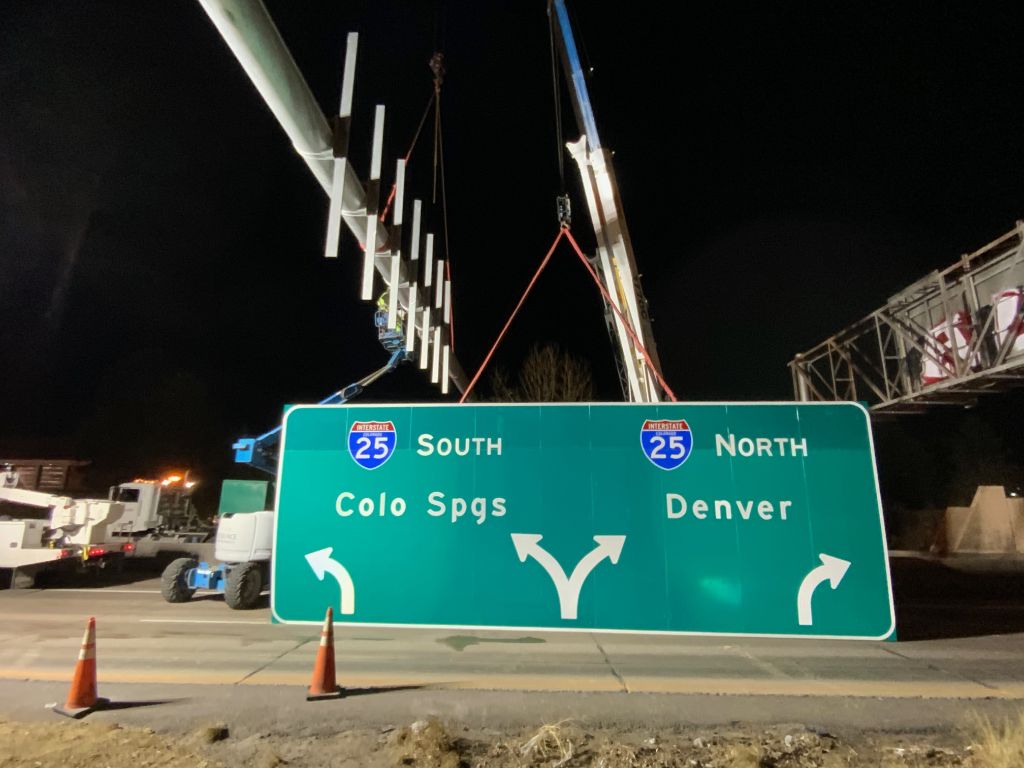 Crews erecting new sign at Phase II location.jpg detail image