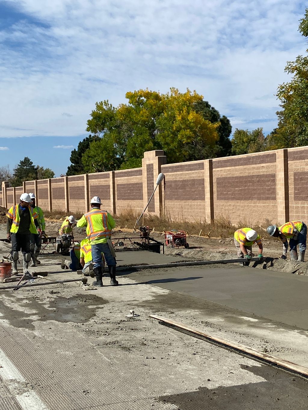 Crews laying concrete for section of auxiliary lane.jpg detail image