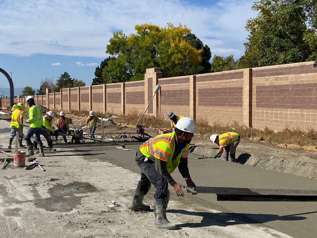 Crews laying concrete pavement auxiliary lane 225 Parker Rd.jpg detail image