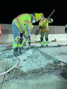 Two workers jack-hammering roadway on I-25 thumbnail image