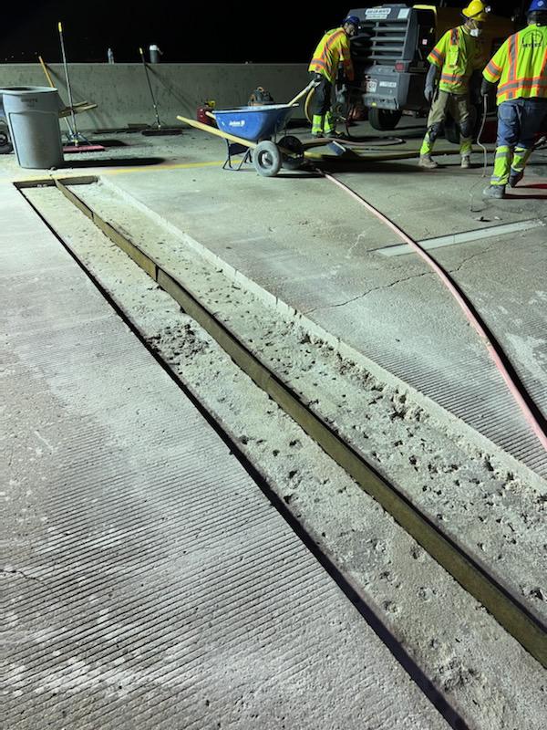concrete slab replacement crew at night detail image