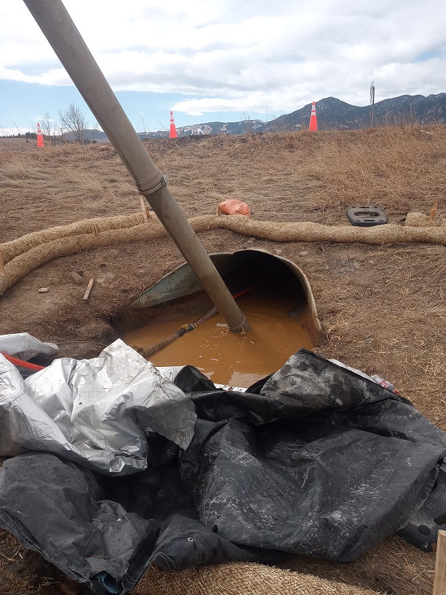 Culvert at CO 128 being cleaned and drained.jpg detail image