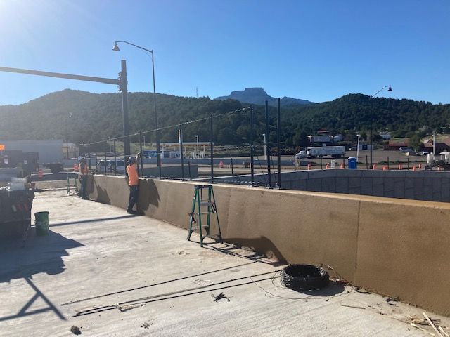 Crews installing safety fence on new bridge at Exit 11 photo Steve Spera.jpg detail image