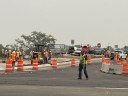 flaggers direct Ward Rd traffic during closure of the off ramp.jpg thumbnail image