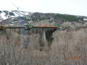 A view of the Maroon Creek Bridge , looking towards Aspen , showing one of two piers with six cantilever segments and the form travelers in place for placement of the 7 th segment.  thumbnail image