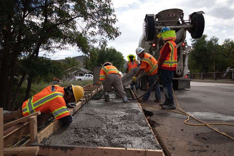 Crews pouring new sidewalk Lyons Bridge Photo Billy Prescott.jpg detail image