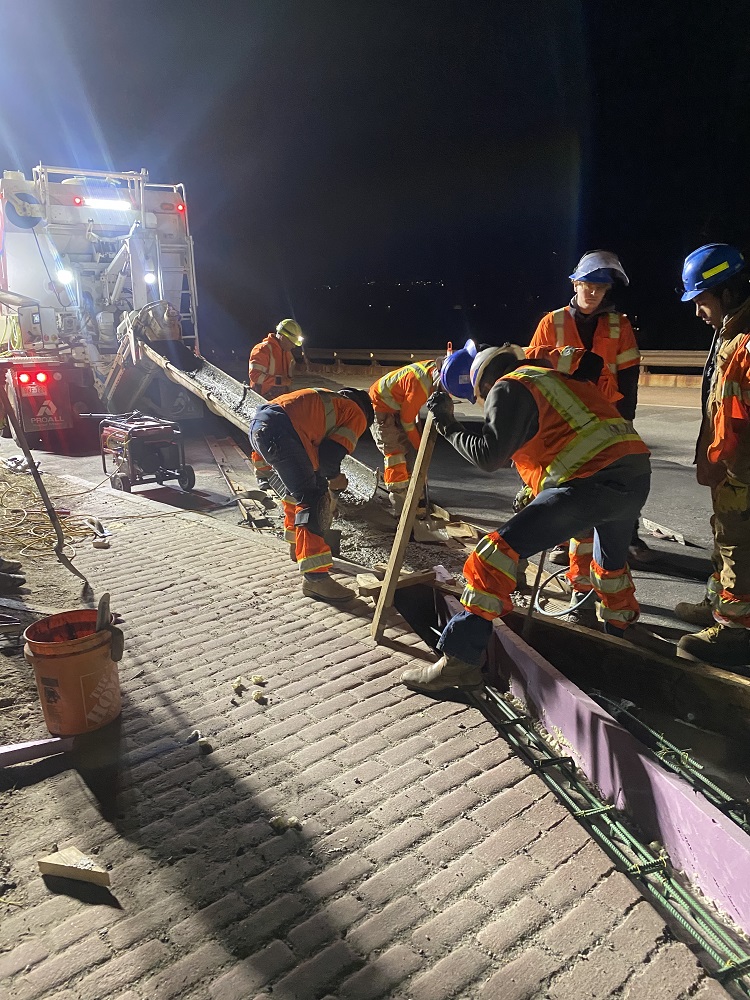 Night crews pouring sidewalks on CO 157 bridge photo Chris Kelly.JPG detail image