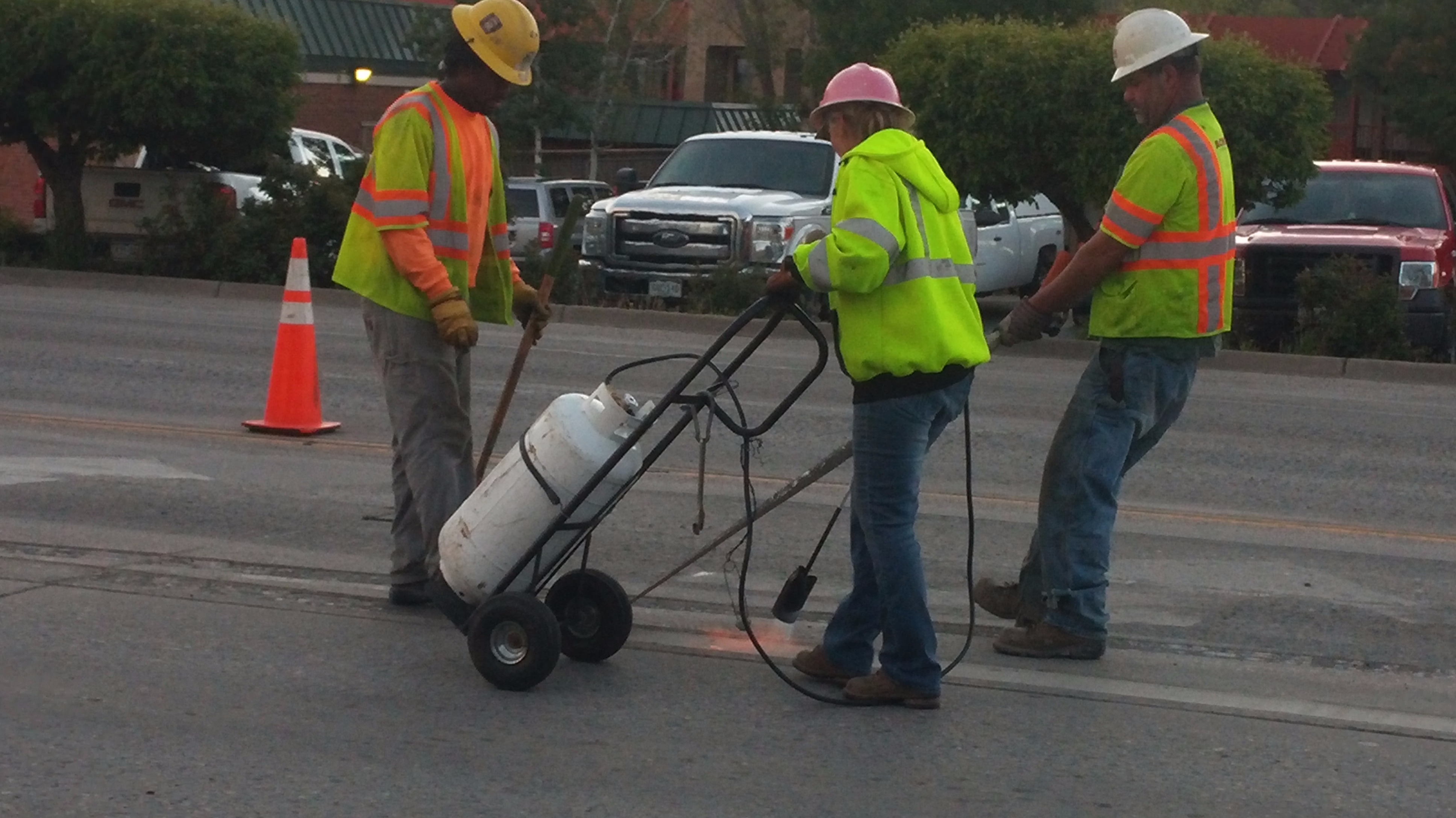 Crews removing epoxy striping at US 550 and College Avenue.jpg detail image