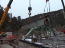 Crews demolish one of the US 34 bridges over the Big Thompson River. thumbnail image