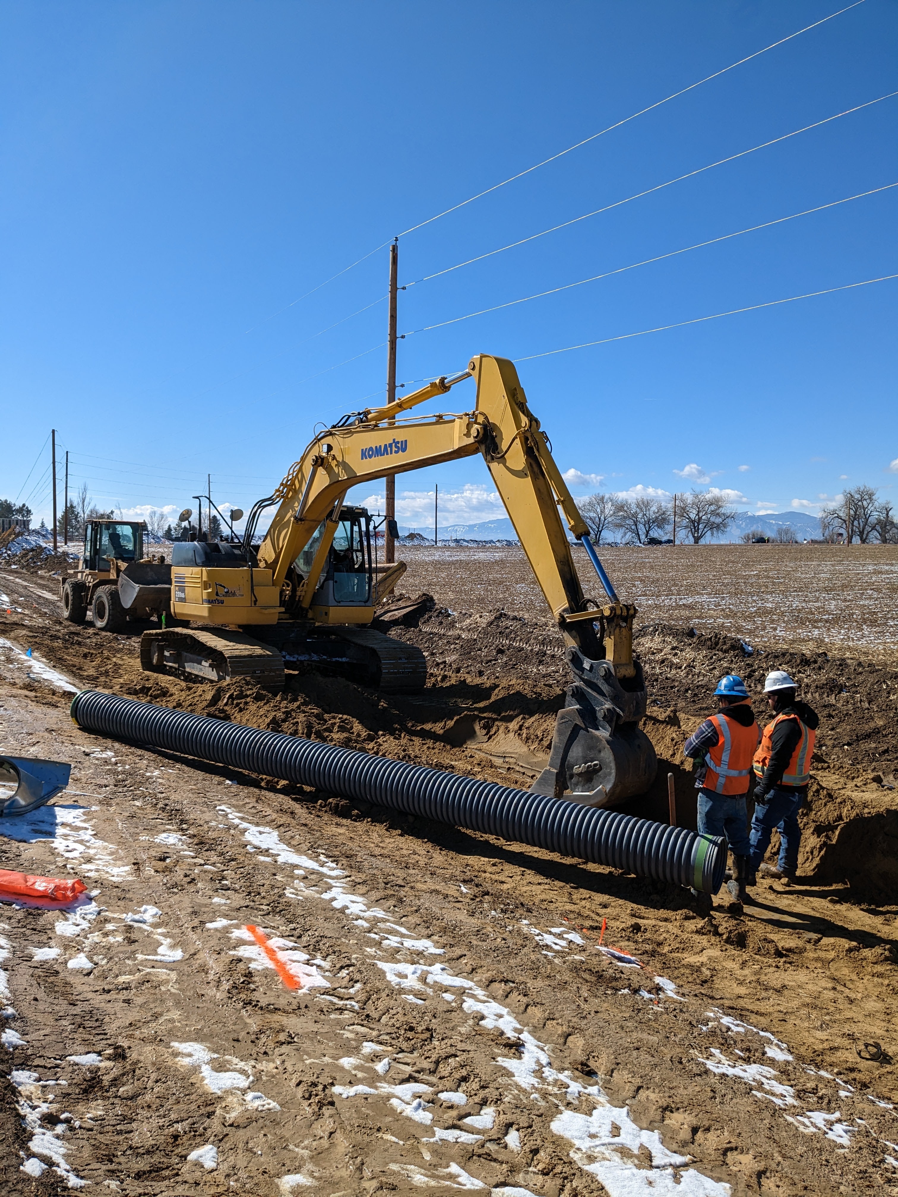 Crews installing irrigation pipe Tim Bricker.jpg detail image