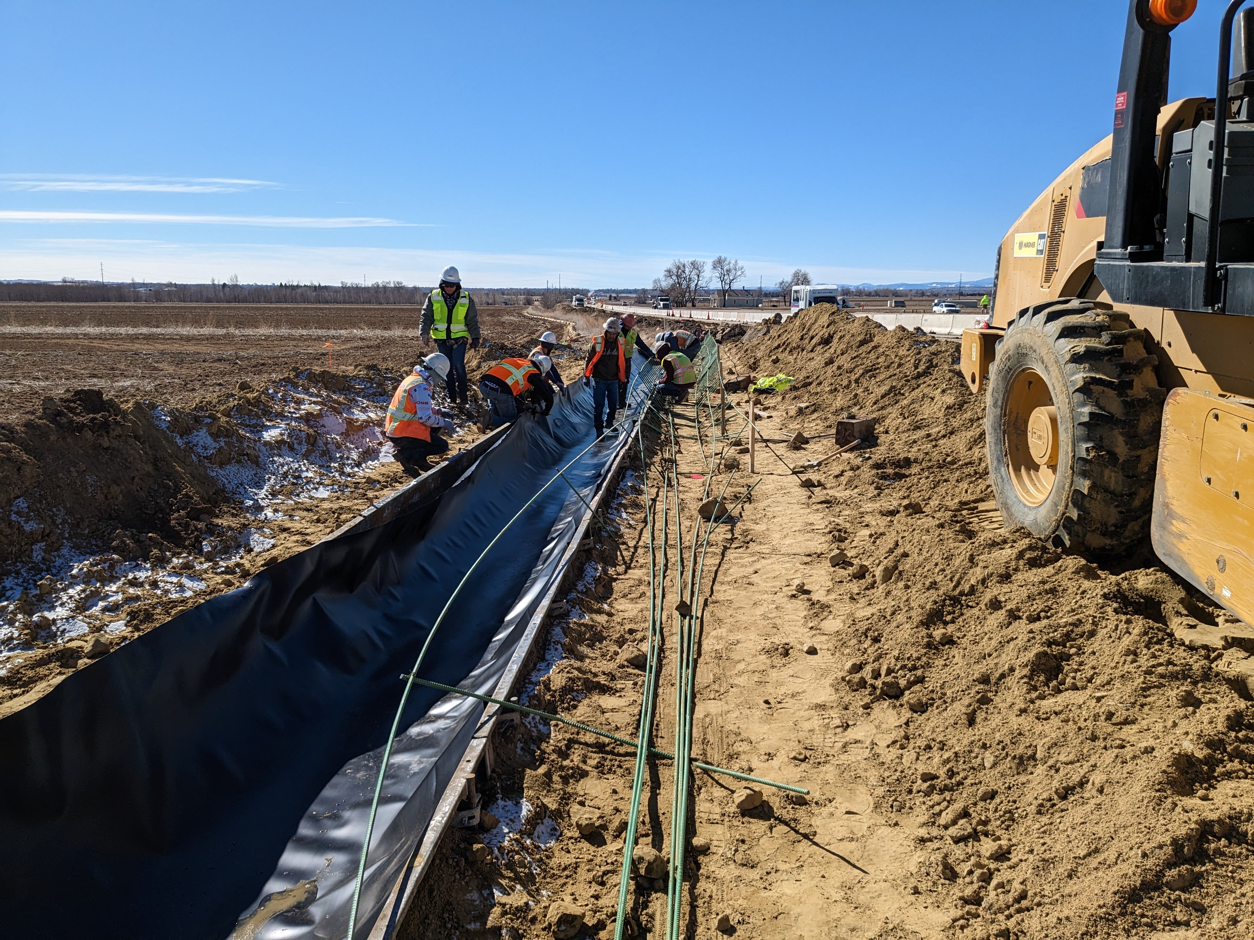 crews lining new irrigation ditch Tim Bricker.jpg detail image