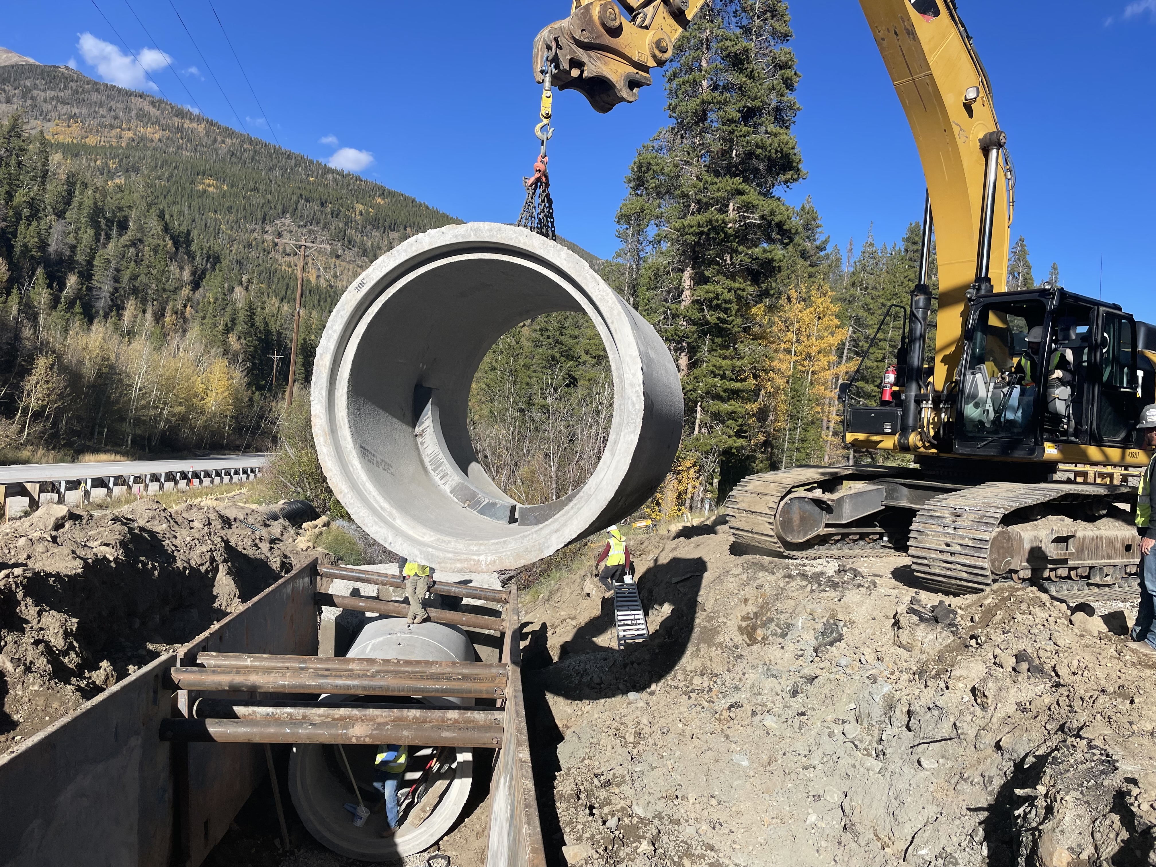 On October 7, construction crews place sections of the concrete culvert beneath the runaway truck ramp on US highway 50 east of Monarch Pass.jpg detail image
