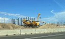 Large yellow machine and vertical steel supports thumbnail image