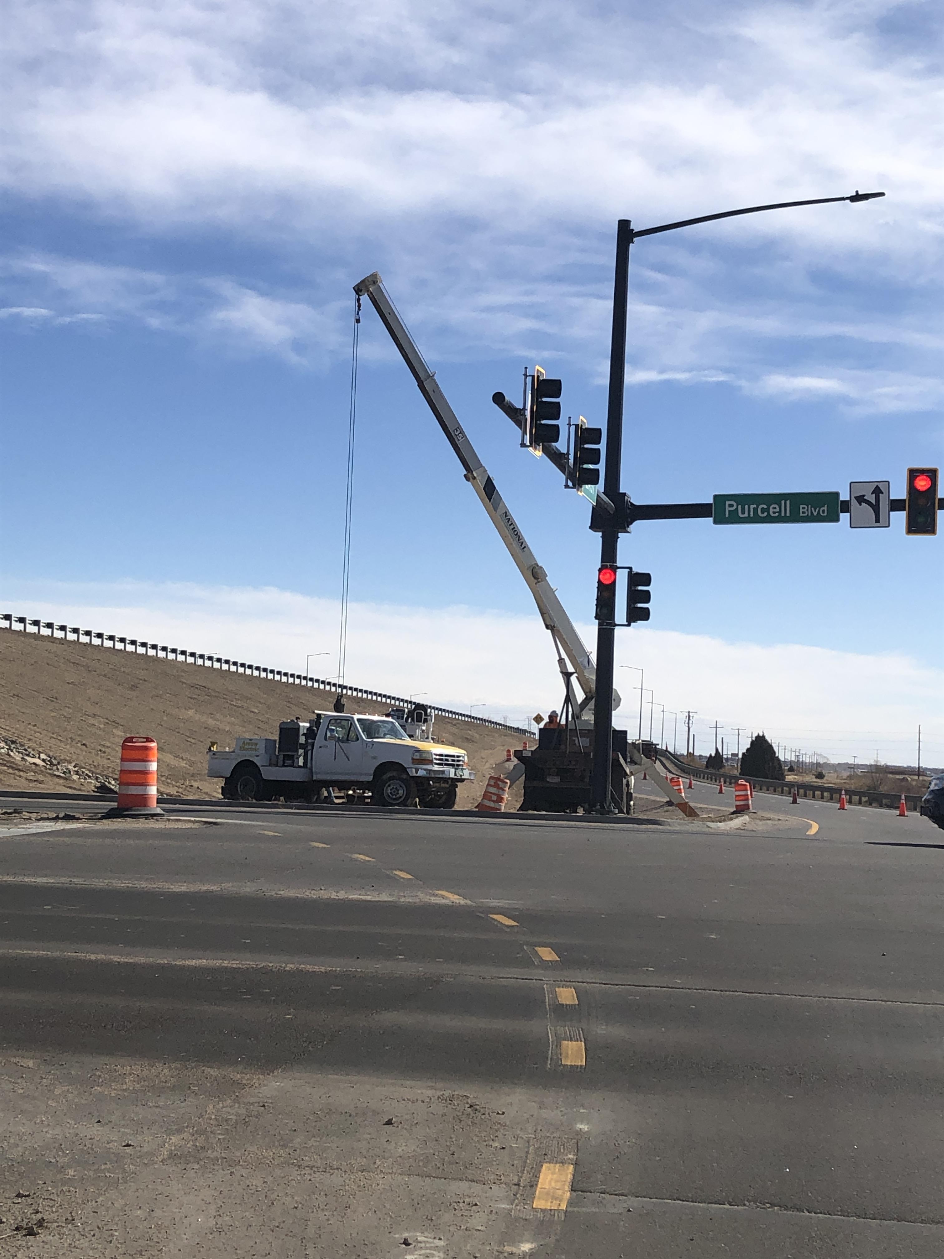 South Traffic Light - Crews remove the temporary south signal pole on Purcell Boulevard at US 50 that has been used for most of the project. detail image