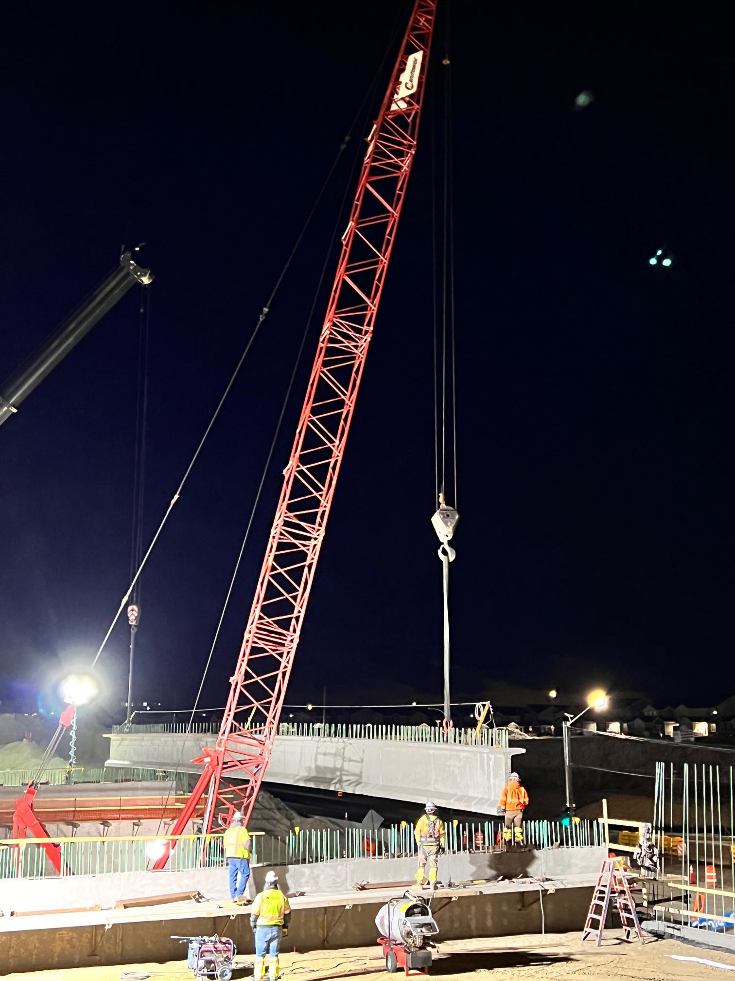 Cranes setting the girders over Reserach Parkway for new bridge construction.jpg detail image