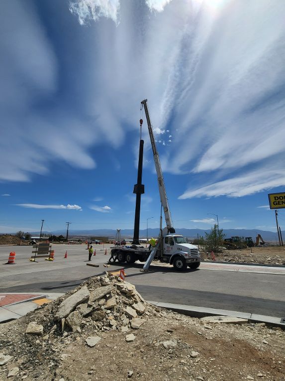 Crews erecting new signal pole at the intersection of CO 115 and Broadway. Photo Holly Lundquist, EST Inc.