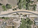 Aerial view of the CO 86 Kiowa Bridge replacement project in Kiowa, showing the temporary shoofly carrying traffic above the bridge work area. thumbnail image
