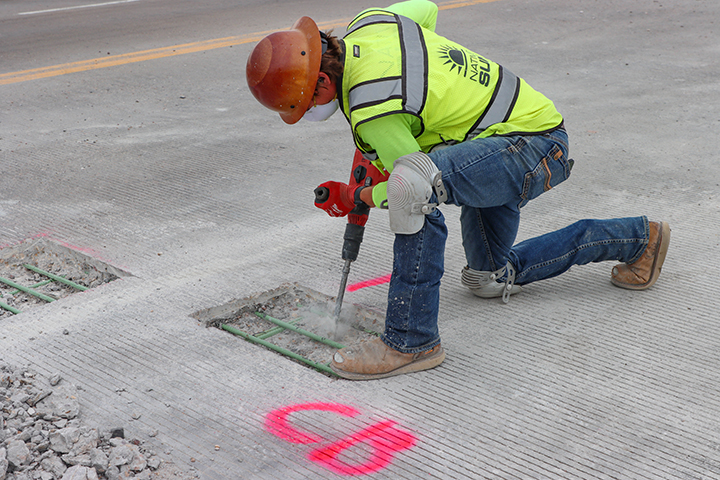 Bridge Repairs in Denver and Adams County Removing concerete between rebar inside Buckley Road bridge structure to gain access to rusted rebar.jpg detail image