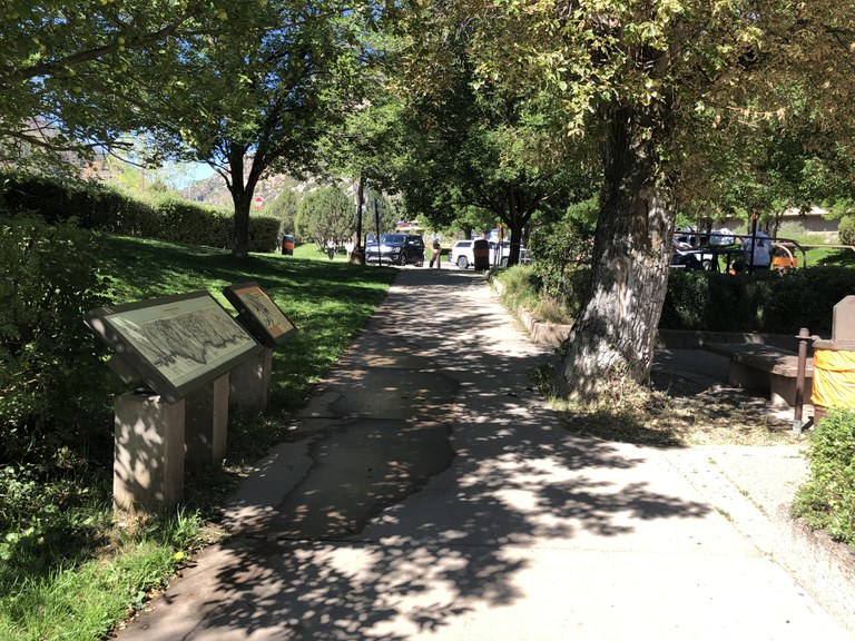 A pathway at the Bair Ranch rest area with location maps on the left side A pathway at the Bair Ranch rest area with location maps on the left side