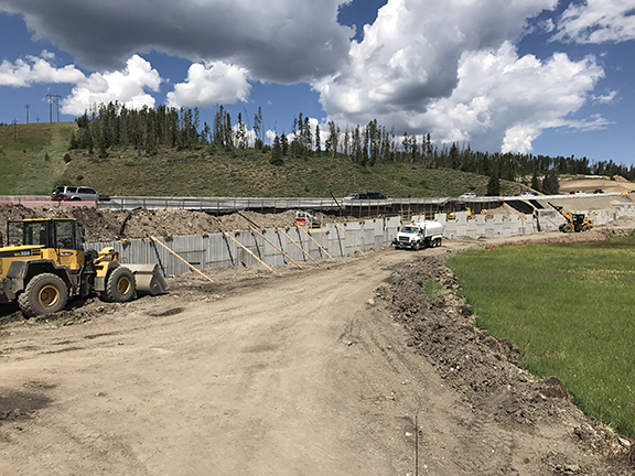 We are building an MSE Retaining Wall for the North Bound lanes on the new alignment. We set the concrete panels then backfill the panels into their permanent positions.