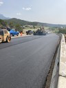 Crews applying asphalt pavement to new detour route to access SB I-25 from Exit 11 (1).JPG thumbnail image