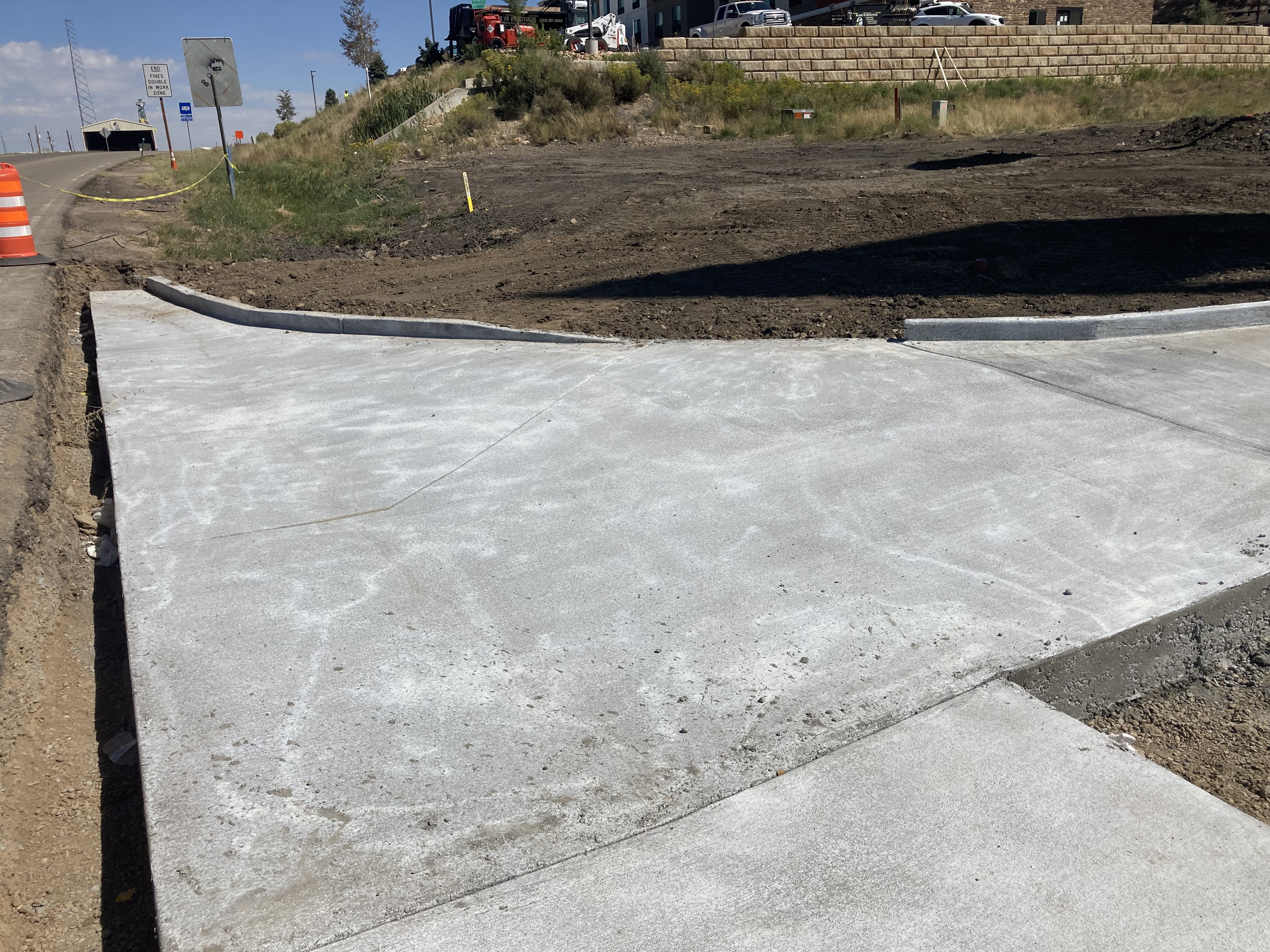 Newly poured concrete for tie in at sidewalk and ADA ramp.JPG detail image