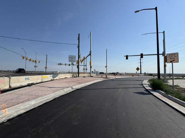 I-25 CO 7 Interim Mobility Hub new slip ramp paving curb and gutter in the northeast corner.jpeg detail image