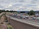 I-25 traffic is shown before the final alignment in preparation for final asphalt paving. The widened roadway will accommodate new acceleration and deceleration auxiliary lanes. thumbnail image