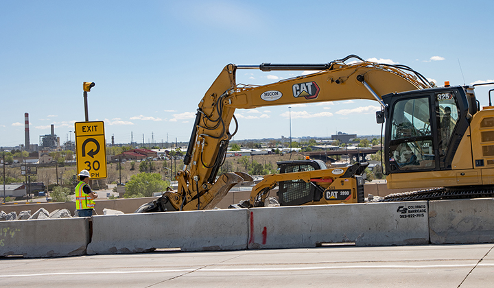 I-270 & US 36 Bridge Preventative Maintenance Excavator removing concrete rubble behind jersey barrier - April 2026.jpg detail image