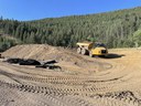 Equipment moving top soil from dirt stock pile. thumbnail image
