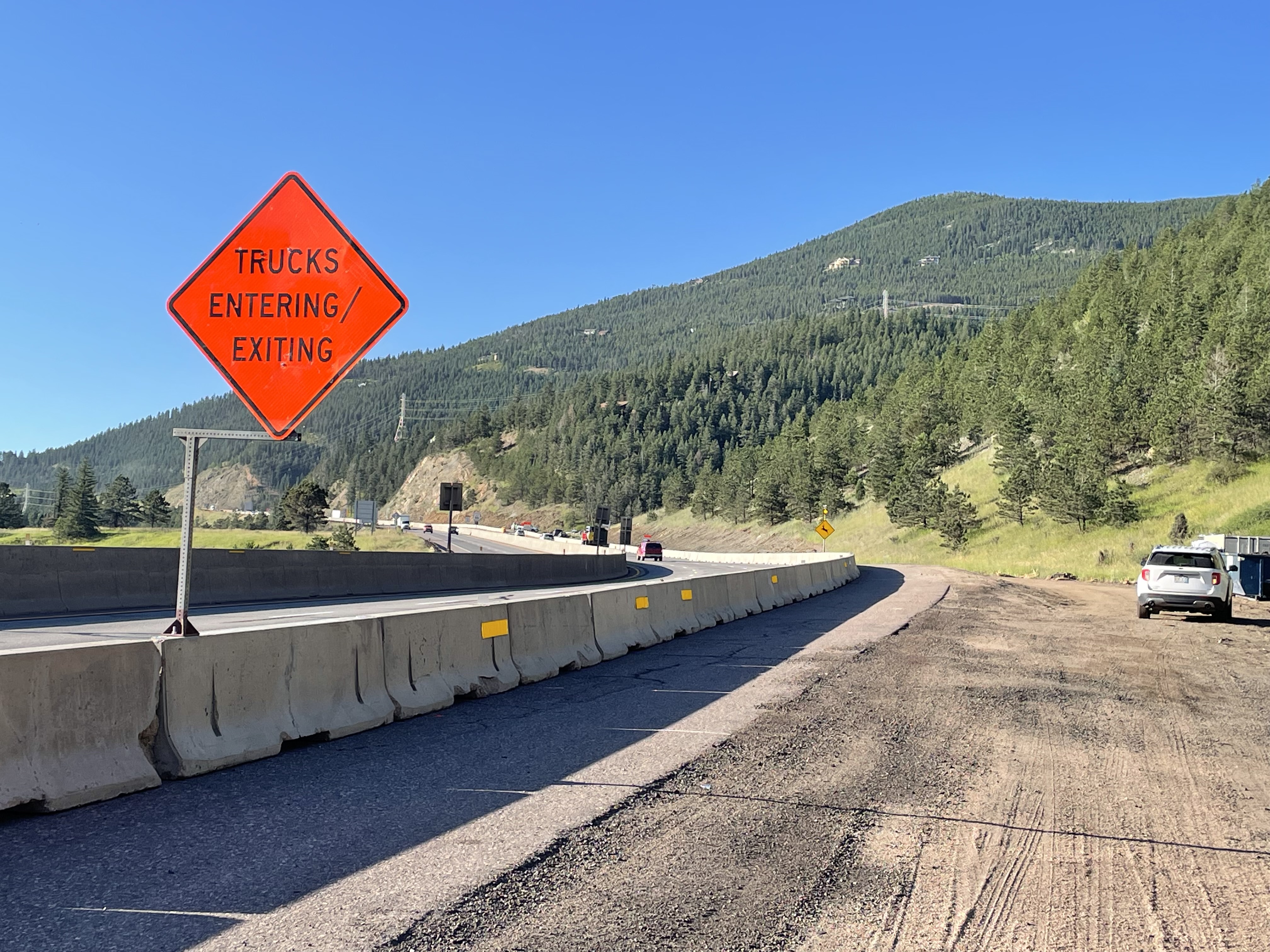 Work zone with a sign saying trucks entering/exiting. — Colorado ...
