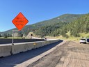 Work zone with a sign saying trucks entering/exiting. thumbnail image