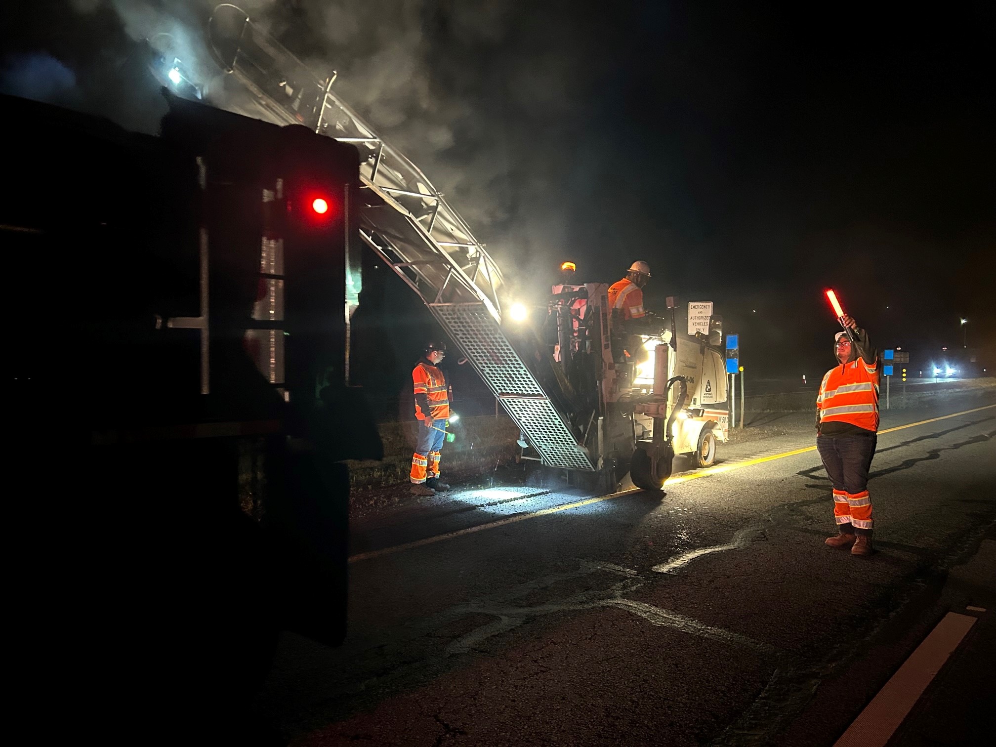 Crews and equipment moving rumble strips. detail image