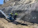 Artist making the shotcrete look like the hillside.