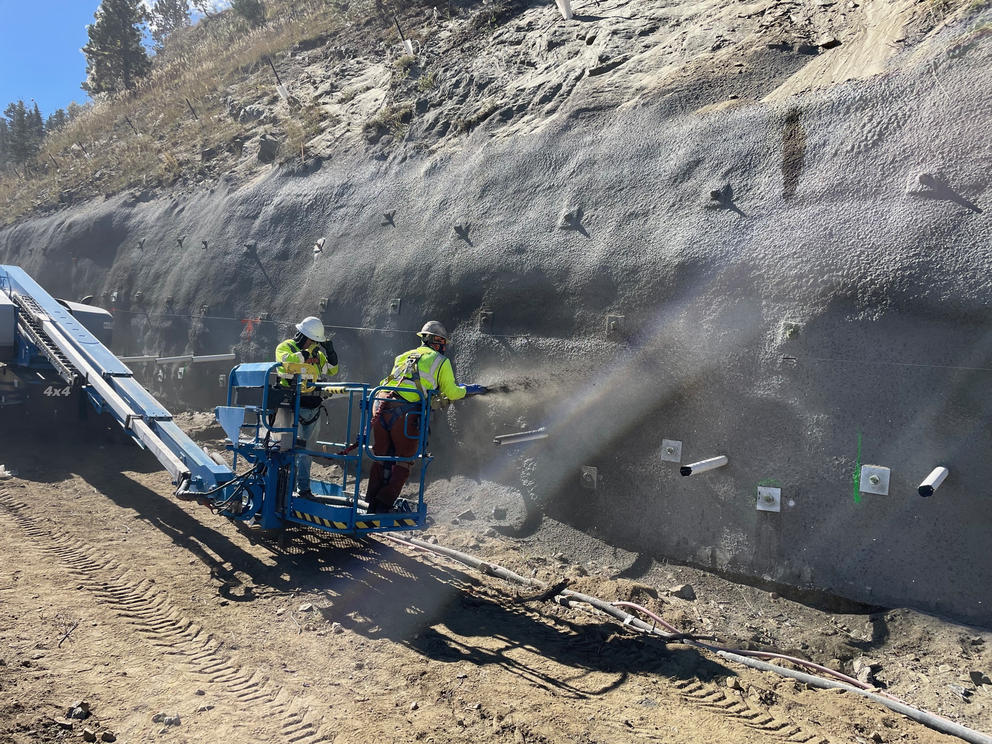 Artist making the shotcrete look like the hillside. detail image