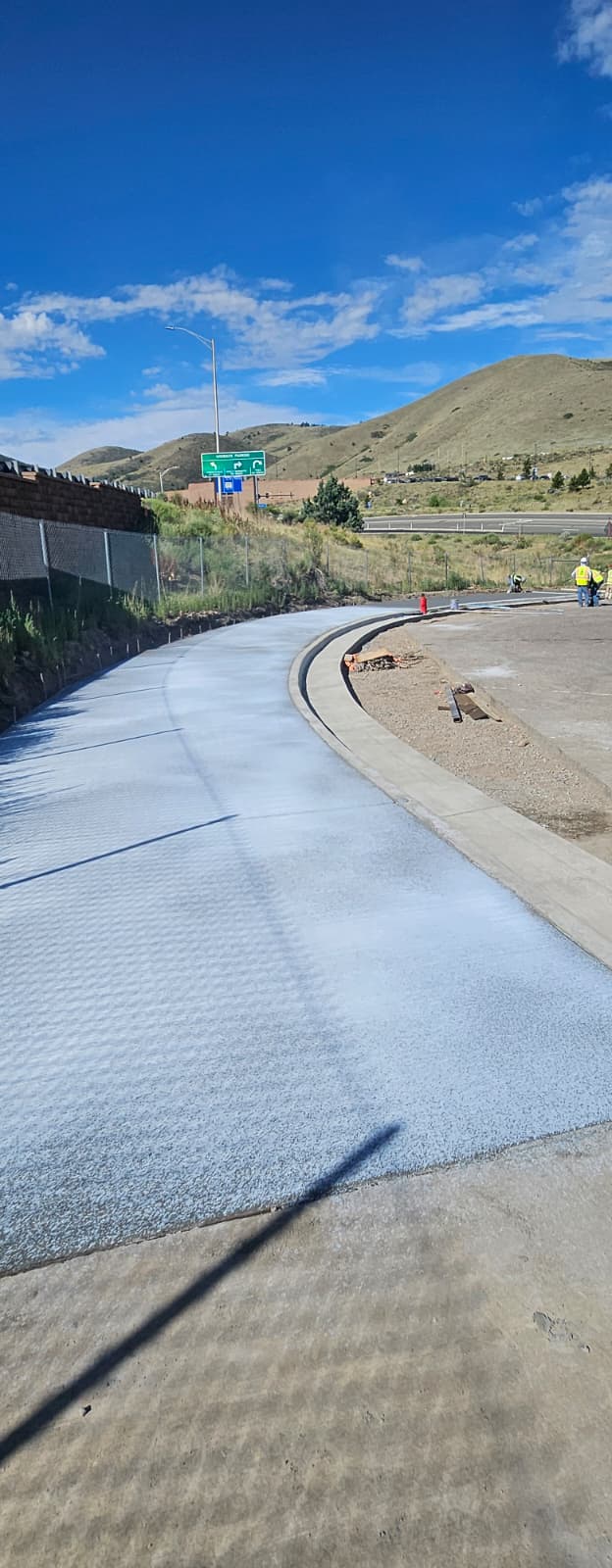 I-70 Geological Hogback Trail Rehabilitation TREX lot new sidewalk, curb and gutter.jpeg detail image