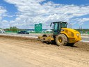 Construction equipment performing roadway compaction thumbnail image