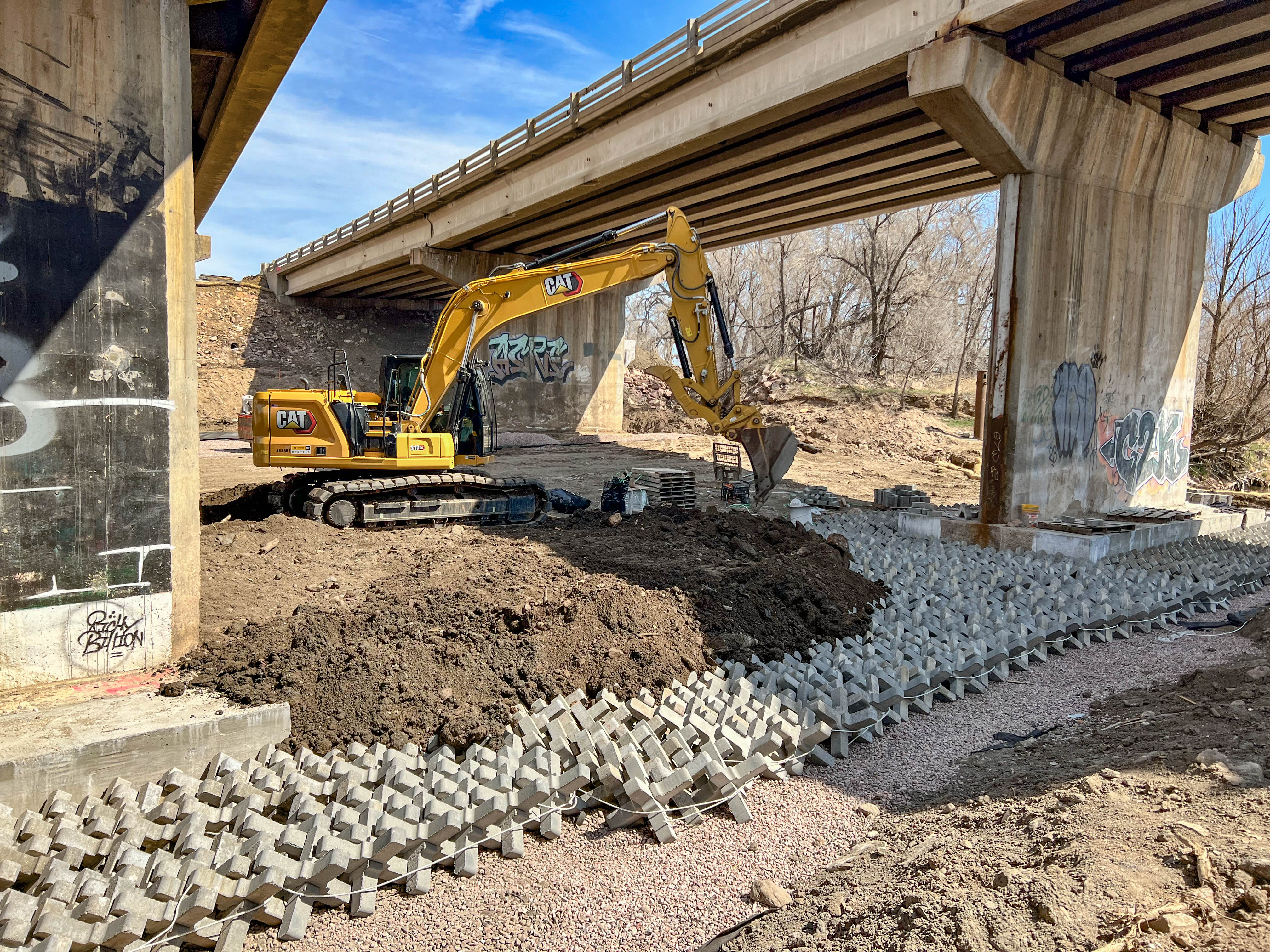 S Academy Bridge_Fountain Creek_excavator covering Ajacks.jpg detail image