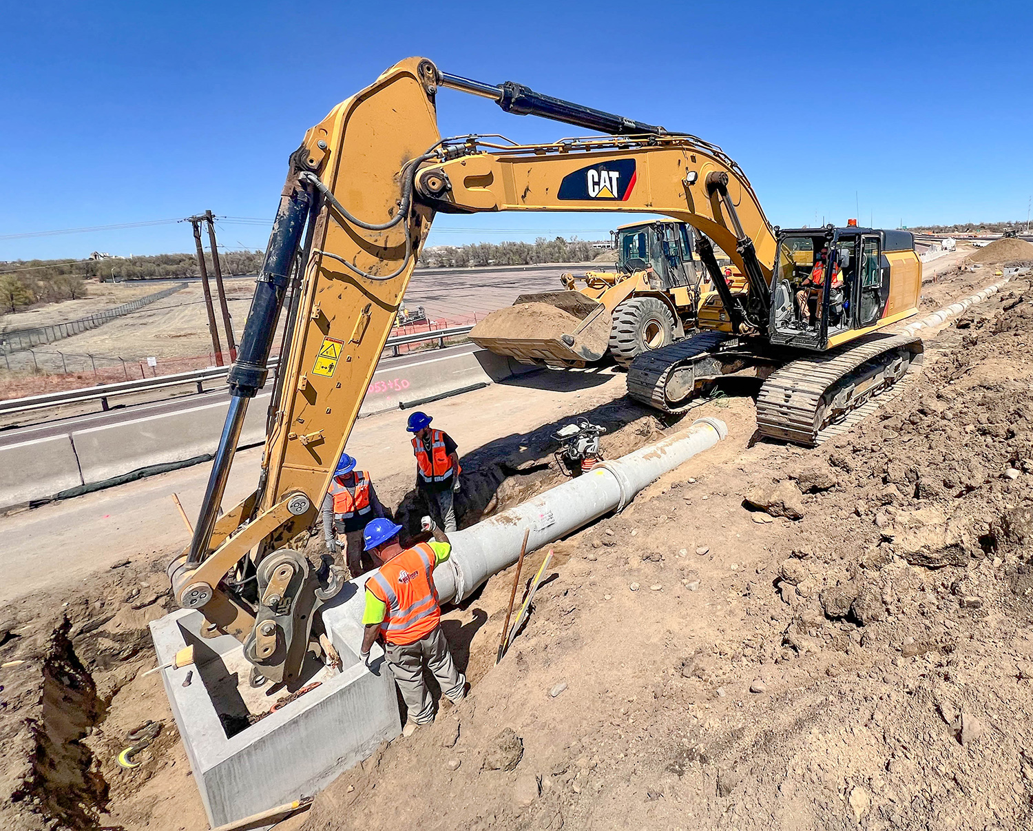 Setting new drainage pipes in median on S Academy Blvd_wide view_sm.jpg detail image
