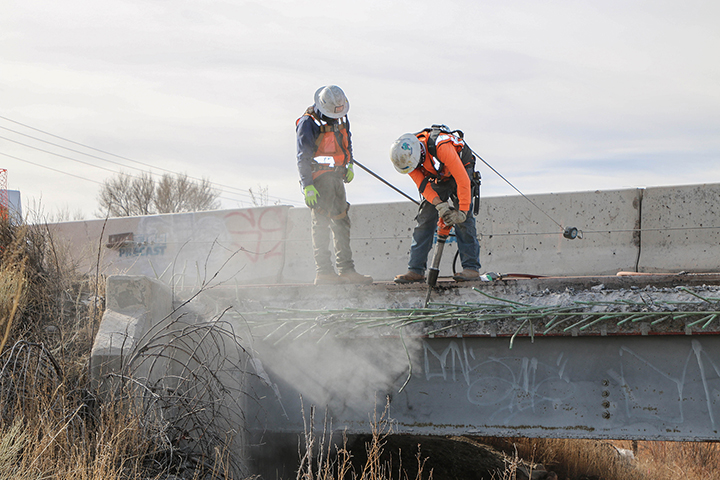 I-25 Dry Wash concrete bridge overhang_2 Men jackhammer_sm.jpg detail image