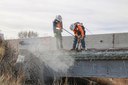 I-25 Dry Wash concrete bridge overhang_2 Men jackhammer_sm.jpg thumbnail image